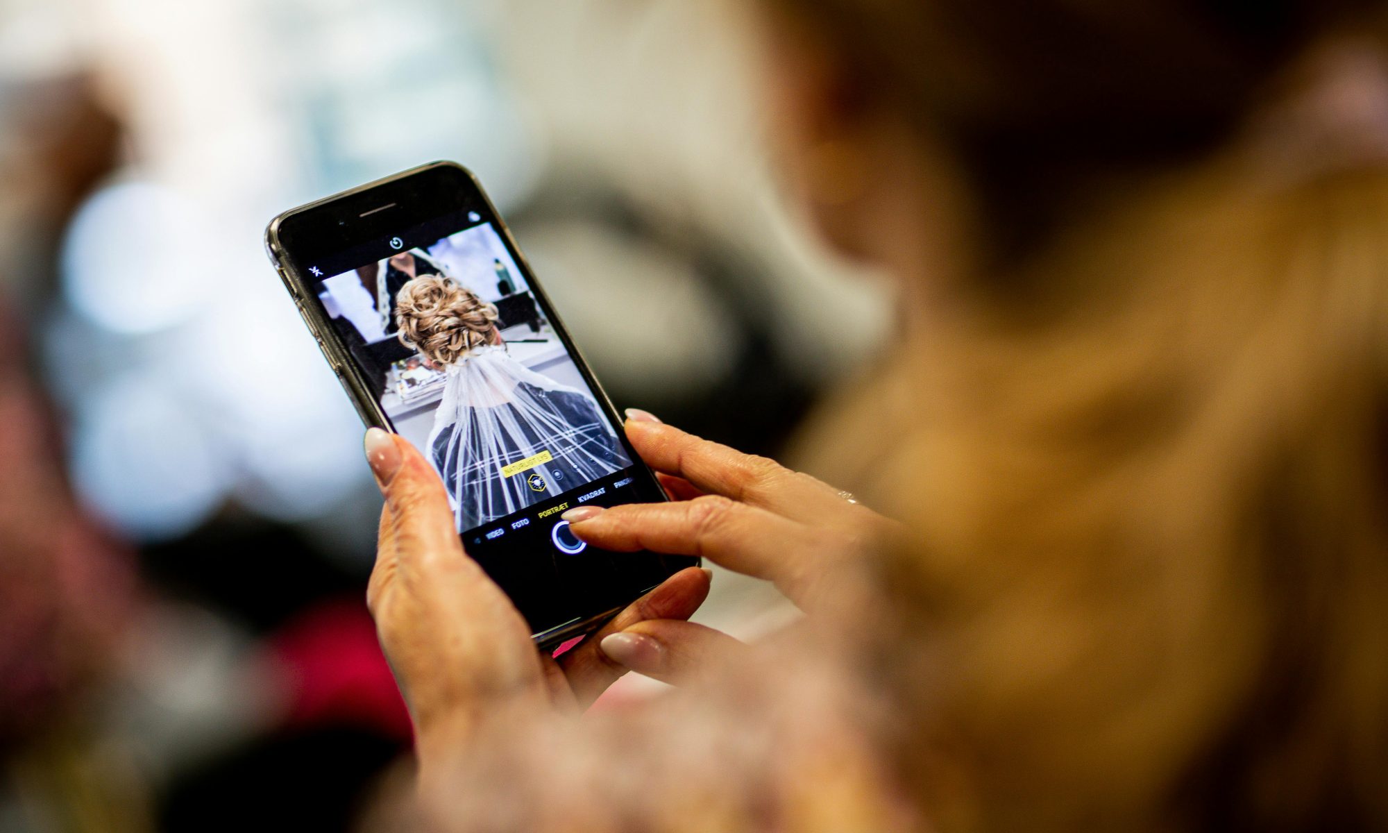 Wedding guest snapping a photograph